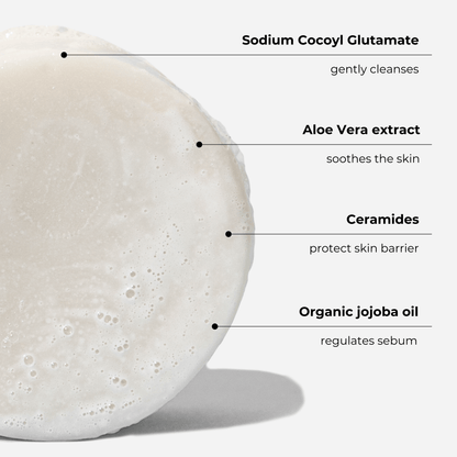 Facial cleansing bar with ingredients: Sodium Cocoyl Glutamate, Aloe Vera, Ceramides, Organic Jojoba Oil for gentle skin care.